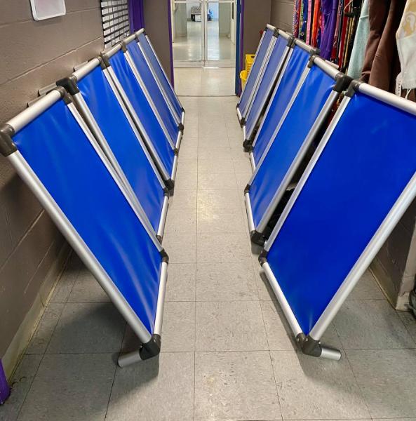 Rows of royal blue colored donated Kuranda dog beds at the Humane Society of Hobart in Hobart, IN