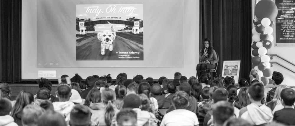 Black and white photo of a school assembly for Indy, Oh Indy